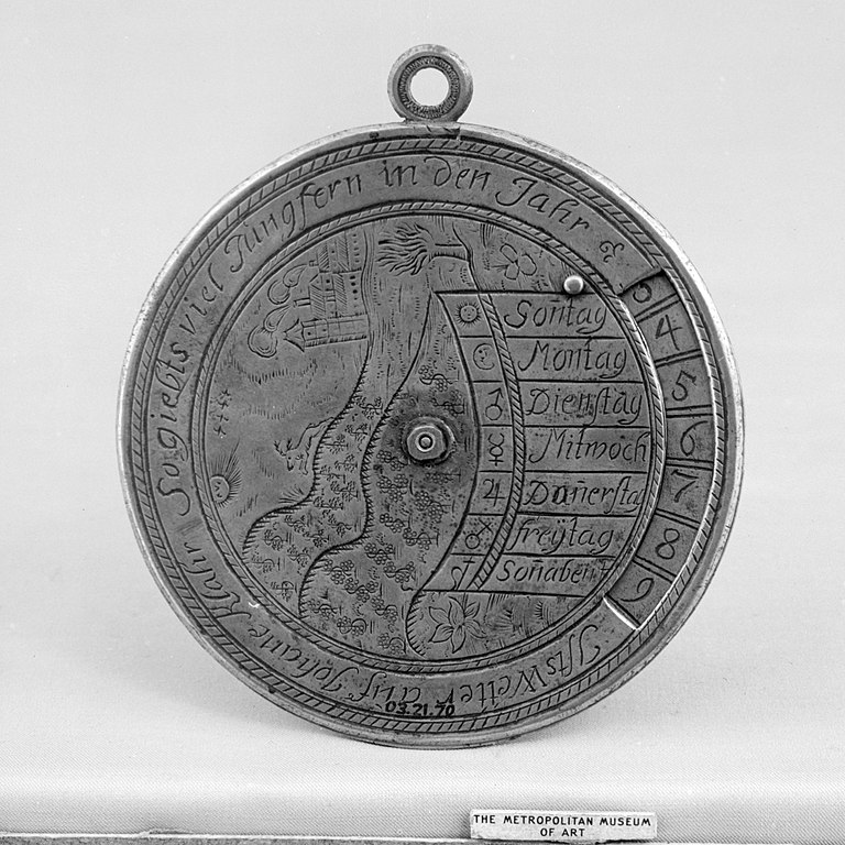 Perpetual calendar inscribed on a dull silver metal disk